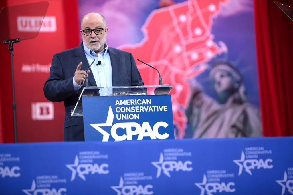 Mark Levin speaking at a CPAC event behind a podium.