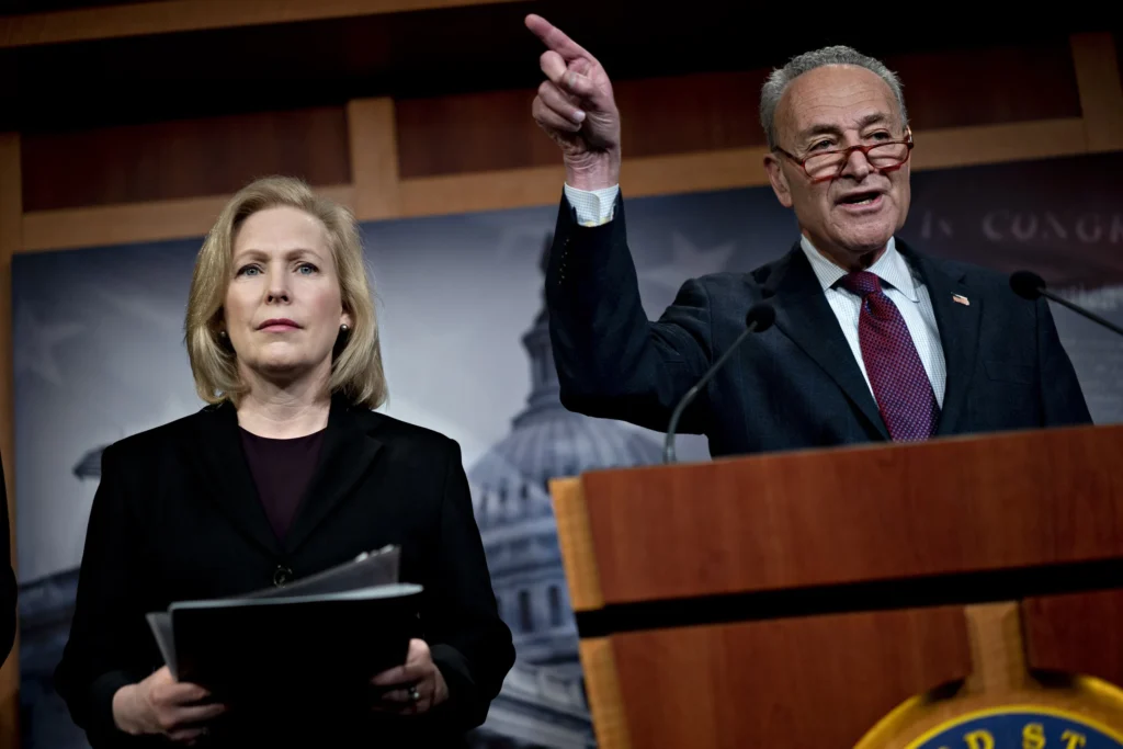 Chuck Schumer and Kirsten Gillibrand speaking jointly at a U.S. Capitol press conference.