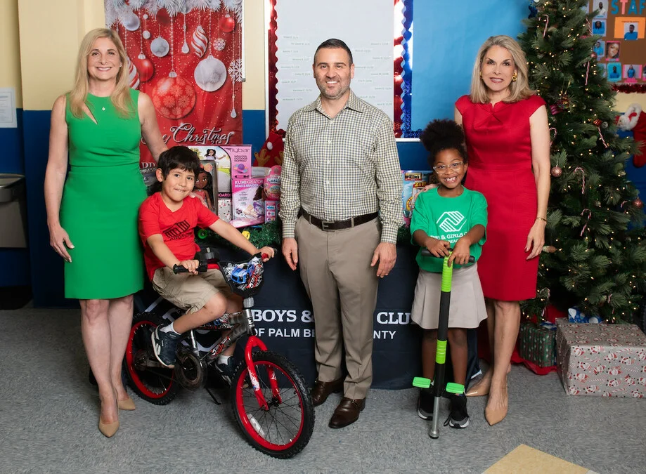 Misha Ezratti at a holiday charity event with the Boys & Girls Clubs of Palm Beach County.