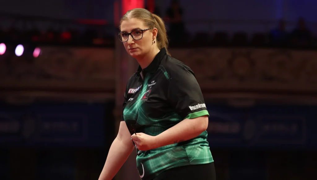 Robyn Byrne throws darts at PDC Women's Series event wearing black and green shirt