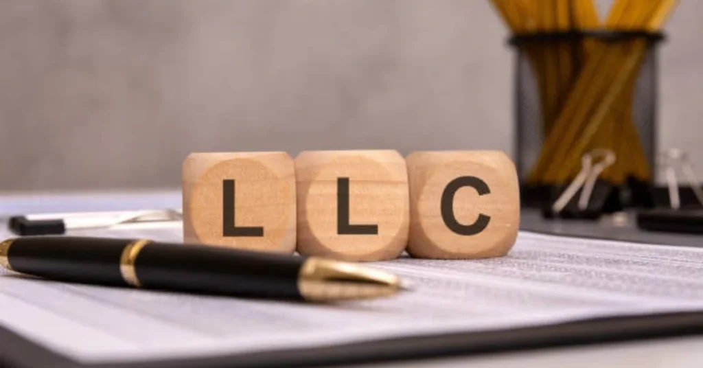 Massachusetts corporation search for LLC name availability with business registration documents and pen