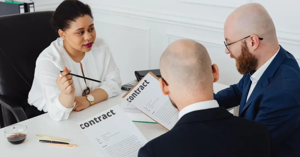 Team reviewing procurement contracts